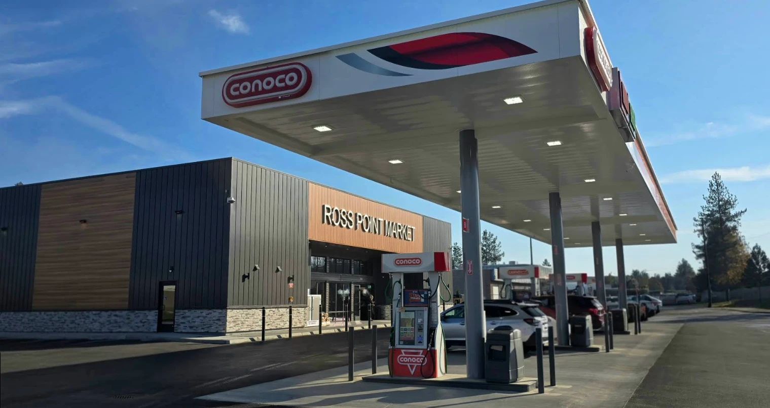 Ross Point Market and its Conoco fuel canopy and pumps on a sunny day